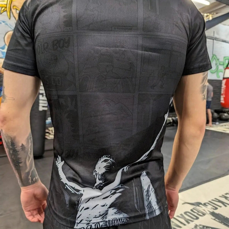 Black Choirboy T-shirt 2.0 back view with large white graphic and subtle comic pattern
