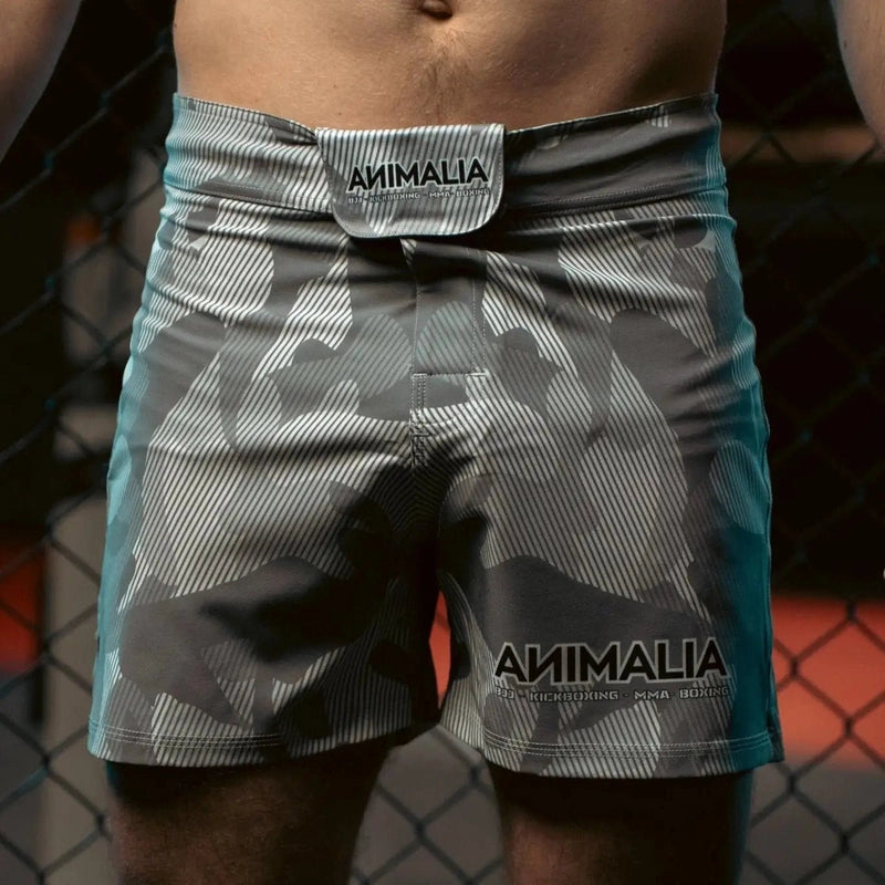 Front view of Animalia camo MMA shorts with branded tag and side pocket