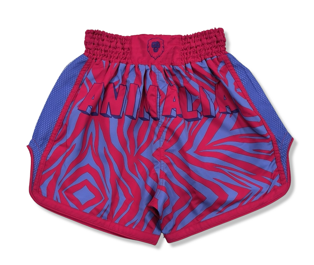 These Pink and Purple Zebra Print Muay Thai Shorts are perfect for any Muay Thai or kickboxing enthusiast looking to add some fun and bright colors to their gear.  With a trippy zebra print design, these shorts are sure to make a bold statement in the ring.