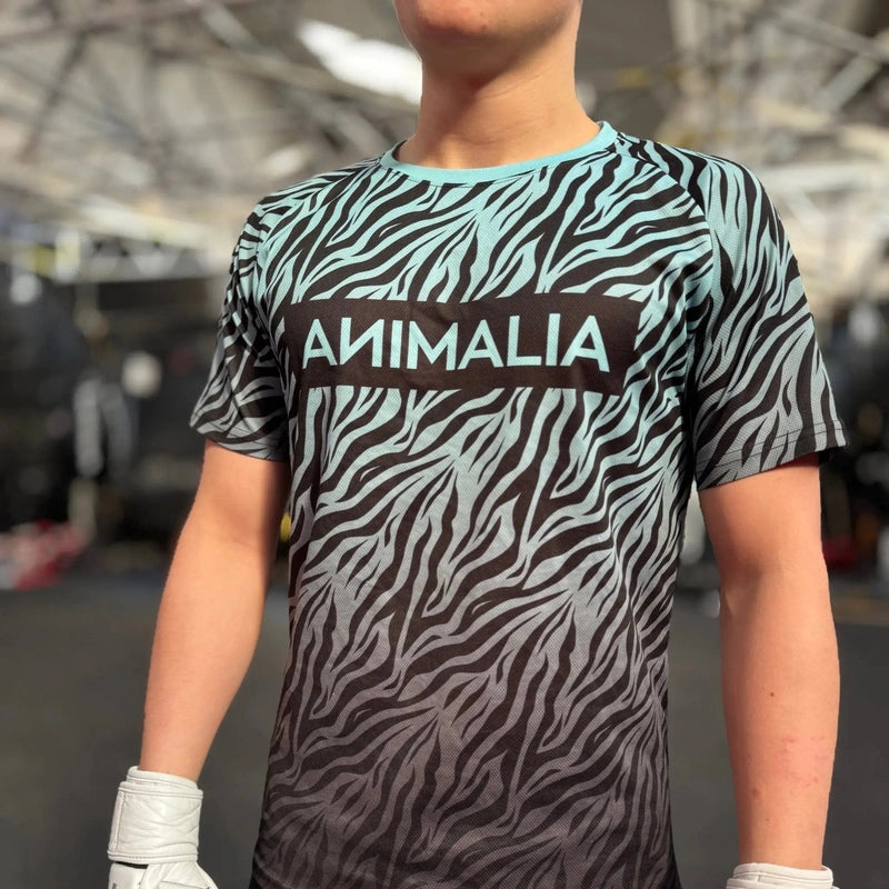 Light blue to gray zebra print athletic shirt detail shot with gloves
