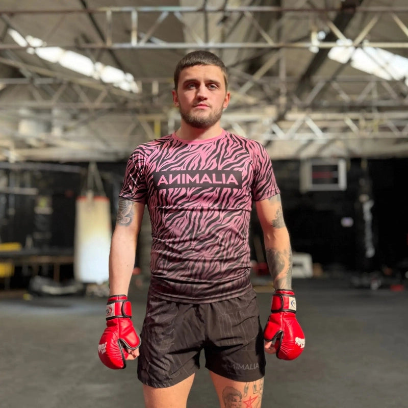 Pink and black zebra stripe athletic t-shirt for men with boxing gloves