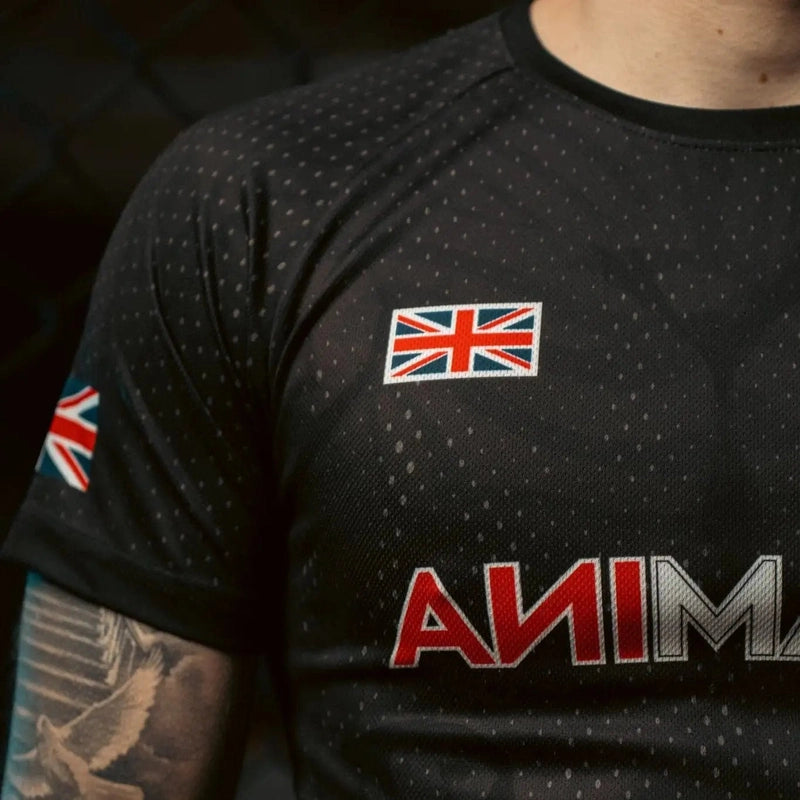 Close-up of black T-shirt chest showing Union Jack patch and dotted fabric texture