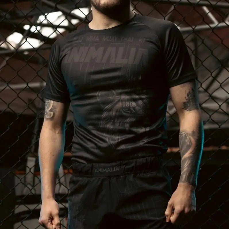 Close-up of black MMA T-shirt with bold Animalia lion chest graphic